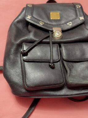 MCM Black Pebbled Leather Drawstring Backpack with Gold Accents
